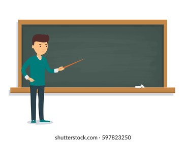 Young student is standing near the training board. Pupil of a school, college and university at the blackboard.