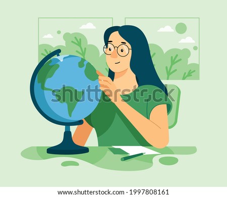 a young student studying geography with a globe in the classroom