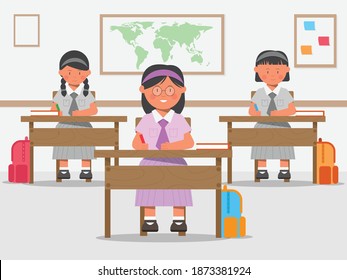 Young students, Arab girls, are studying in a classroom
