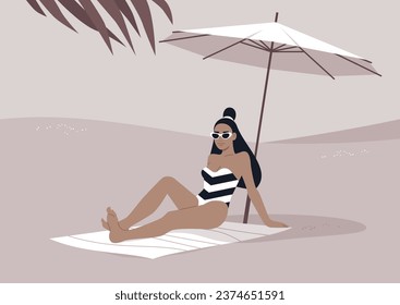 A young stylish woman relaxes on the sandy shore beneath a white beach umbrella, enjoying her summer getaway amidst the sweltering tropical heat