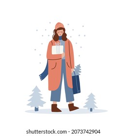 Young stylish Woman in winter clothes holding Christmas gifts box and walking outside. Female character wearing casual outdoor clothes Isolated on white. Vector flat hand drawn illustation.