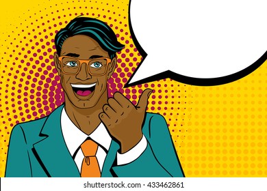 Young surprised afro american man in glasses with open mouth pointing finger with speech bubble in pop art retro comic style.