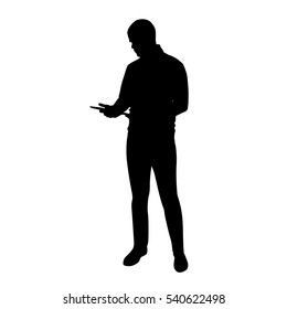 Young Tall Man Standing And Holding Tablet In His Hands, Vector Silhouette