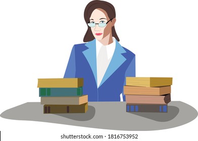 
A young teacher in a bright jacket sits at a desk with stacks of books.