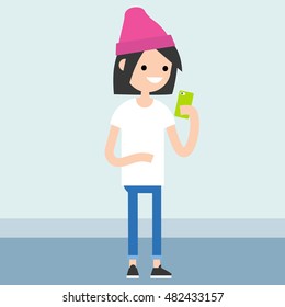 Young teenage girl is looking at her smart phone's screen / editable vector illustration