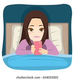 Young teenager girl using smartphone in bed addiction problem concept