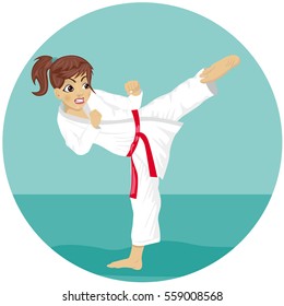 Young teenager red belt karate girl in kimono practicing kick exercise