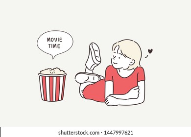 A young teenager watching movies in floor with popcorn. Hand drawn style vector design illustrations.