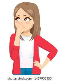 Young teenager woman pinching nose feeling bad smell