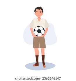 Young Thai Student Boy Playing Football After School. Boy with football