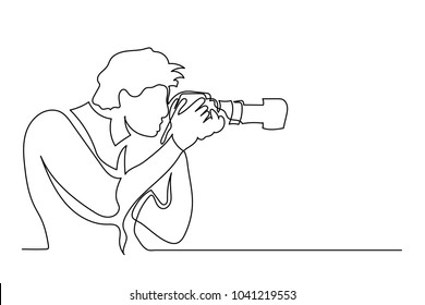 Young tourist man photographer with a camera takes pictures. One line drawing isolated vector object by hand on a white background.