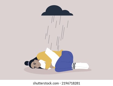 A young upset Asian character squeezing a pillow, a black rain cloud hovering above them