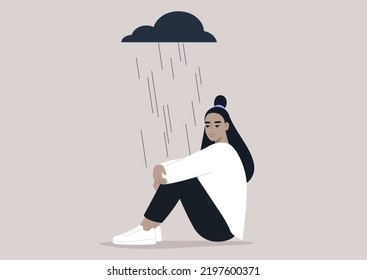 A young upset character hugging their knees, a black rain cloud hovering above them