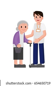 young volunteer man caring for elderly woman. Adult man helping and supporting old aged female. Older person standing in front of volunteer.