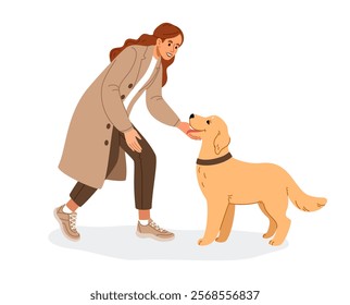 A young woman is bending down to her cute dog to play and pet it. The dog owner and her pet are happy to see each other.