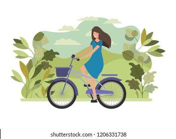 young woman in bicycle on the park