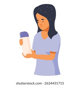 Young woman carefully reading product information on a cosmetic bottle