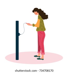 Young woman charging her phone from a wall outlet. Concept vector illustration in cartoon style isolated on white. Great for web-sites, books, magazines.