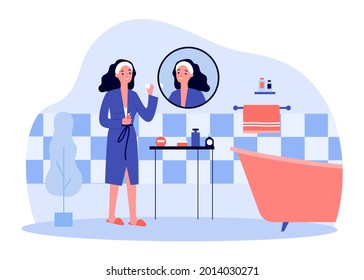 Young woman cleaning face with cotton pad in bathroom. Female character doing morning routine flat vector illustration. Skin care, beauty concept for banner, website design or landing web page