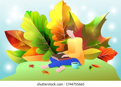 A young woman in a clearing with books on the background of autumn leaves.