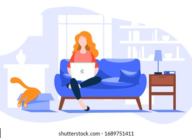 Young woman at computer on internet, working from home in the period of quarantine. Young woman stays isolated at home and working online at home at the laptop.