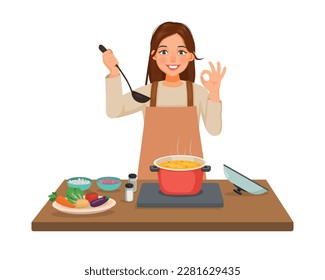 Young woman cooking delicious vegetable soup in the kitchen making okay gesture