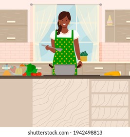 Young woman cooking salad in kitchen. Household activity, housekeeping, everyday duties and chores