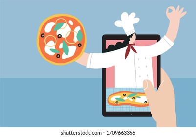A young woman cooks at home in isolation and in quarantine and watches a cook’s video workshop online. 