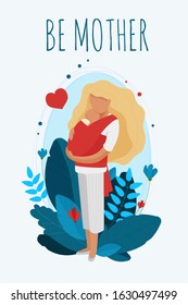 A young woman cuddling a newborn baby in a red sling. The joy of motherhood. Being a mother. A mother's love for her child.