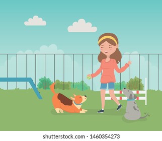 young woman with cute little dogs mascots in the field