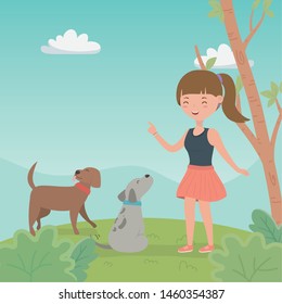young woman with cute little dogs mascots in the field