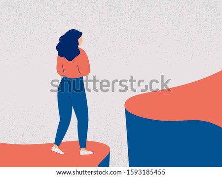 Young woman decides to take a difficult step into the future. Girl in fear and indecision is worth on the edge of a cliff and looks forward. Concept of a difficult choice, decision making. Colorful ve