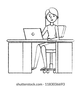 young woman at desk with laptop