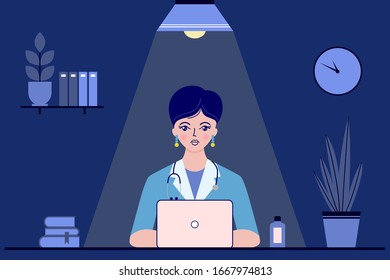 Young Woman Doctor Sitting At The Desk In Doctor's Office At Night. Medical Concept.