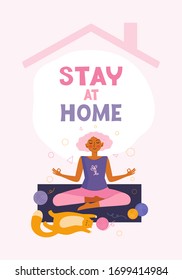 Young woman does yoga and meditation at home together with her pet. Spending time. Leisure in quarantine. Sport exercise at home. Healthy lifestyle and relaxing. Time for yourself