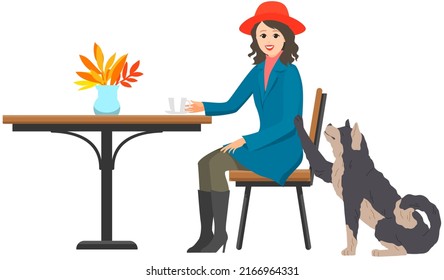 Young woman with dog on street at cafe terrace. Female pet owner sitting in restaurant with domestic animal. Caring for animals, joint pastime with pets concept. Girl with doggy spends time outdoor