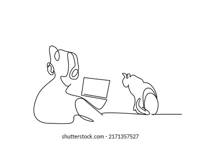 Young Woman Doing Business Studying At Home Spending Time With Her Cat In Front Of Laptop With Headphones On Her Head