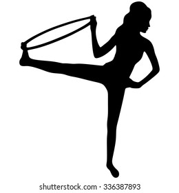 A young woman doing exercise with a hula-hoop.Fitness woman.