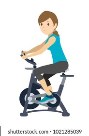 Young Woman Doing Exercise On Static Bike