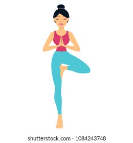 Young woman doing yoga exercise tree-pose