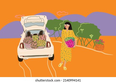 Young woman in dress carrying bag with flowers outdoors on nature. Car with opened car trunk full of flowers. Concept of beauty and Italian lifestyle