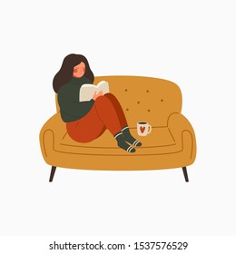 young woman dressed in a warm sweater sits on the couch and reads a book. The girl is resting at home and drinking coffee. Character vector illustration
