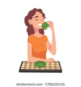 Young Woman Drinking Tea, Cheerful Girl Sitting at Table with Checkered Tablecloth Enjoying Eating of Delicious Food Cartoon Vector Illustration