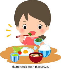 Young woman eating Japanese morning meals