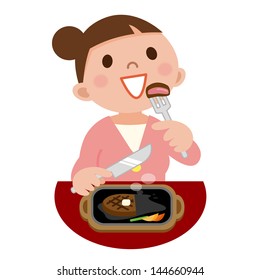 Young woman eating steak