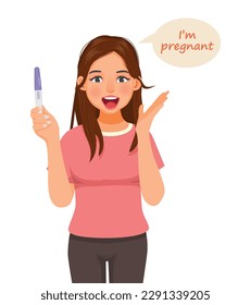 Young woman excited holding positive pregnancy test result with two red stripes