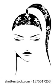 A young woman face with long hair and flowers.