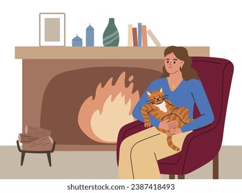 Young woman with a fluffy cat on her lap sitting in armchair near the fireplace. Cat lover.  Warm in winter. Heating system. Energy crises.