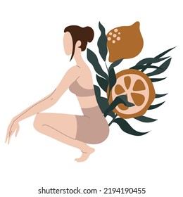 Young woman in front of lemons and leaves.