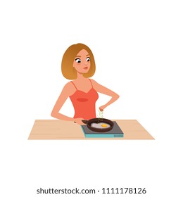 Young woman frying eggs in a frying pan, girl preparing healthy meal in kitchen vector Illustration on a white background